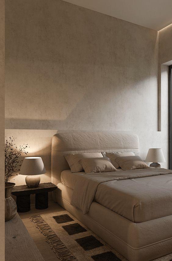 Dormitorio cálido con lámpara de mesita y luz ambiental suave