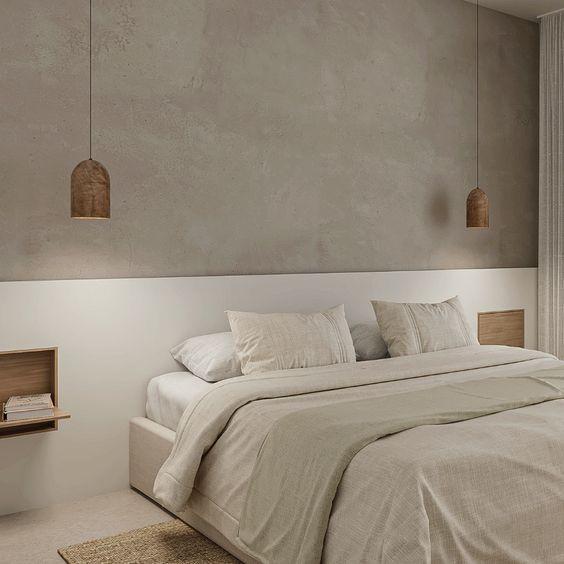 Dormitorio minimalista con lámparas colgantes y cabecero integrado